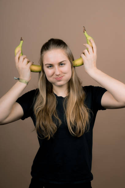 istock girl with a banana 1137264593