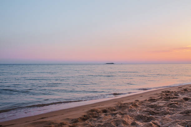 A sunset view of beach on Corfu, Greece, one of the Island's most popular resorts stock photo