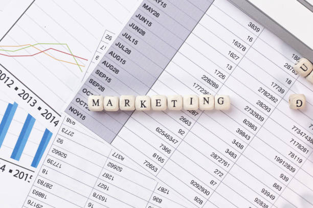 istock The marketing word on wood cube business content image. 1137267771