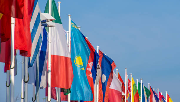 istock Low Angle View Of Flags Waving Against Sky 1137271698