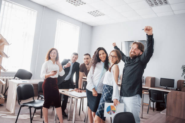 istock Happy young colleagues smile and have fun at the creative office. 1137272321