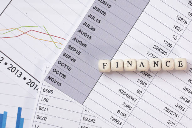 istock The finance word on wood cube business content image. 1137272457