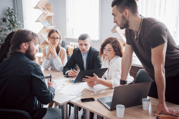 istock Successful business people are talking and smiling during in office. 1137272589