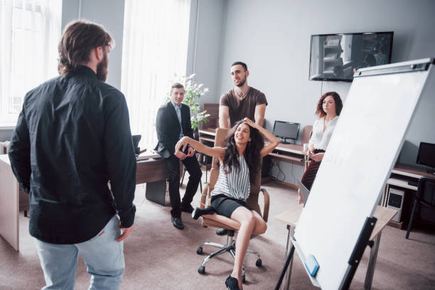 istock Happy young colleagues smile and have fun at the creative office. 1137272821