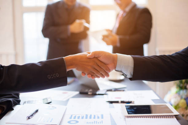 istock Business group or business partners discussing documents and ideas at meeting 1137272937