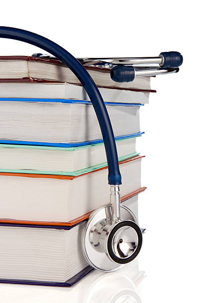 istock books and stethoscope isolated on white 113728257