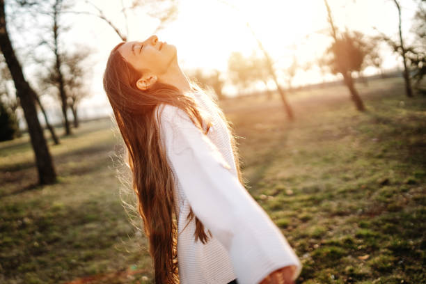 istock Girl enjoying sunny day in park 1137285038