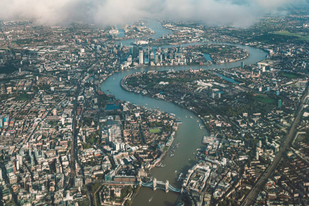Aerial view of river Thames in London Aerial view of river Thames in London from an airplane. thames river stock pictures, royalty-free photos & images