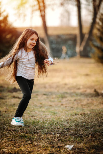 istock Girl enjoying sunny day in park 1137286561