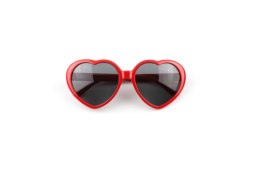 Red heart shaped sunglasses isolated on white background, summer holidays, valentines day, travel.