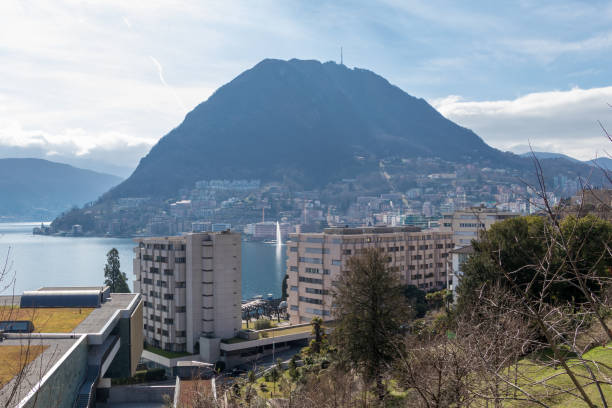 buildings at lake lugano and mountains in lugano, ticino canton of switzerland - switzerland ticino canton lake lugano imagens e fotografias de stock