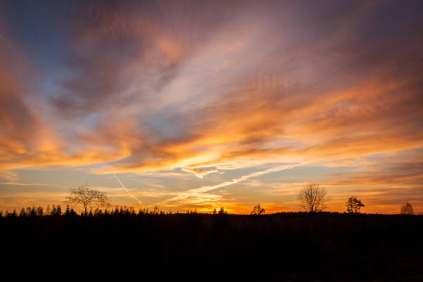 istock Beautiful vibrant sunset clouds landscape in finland 1137293701