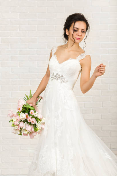 istock Portrait of beautiful bride with wedding bouquet 1137295572
