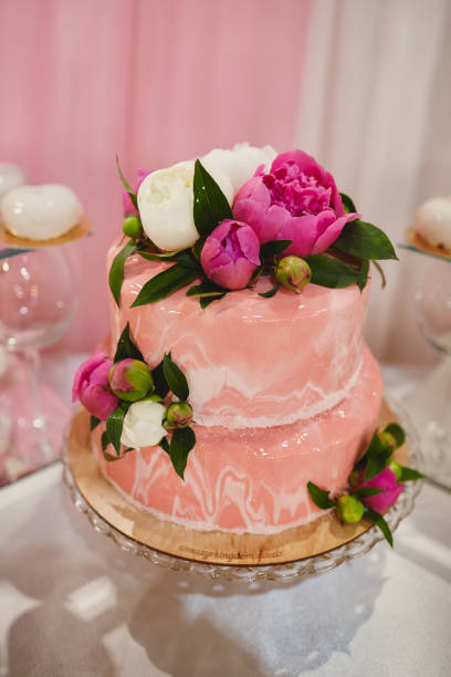 istock Wedding pink cake with flowers for wedding day. 1137296280