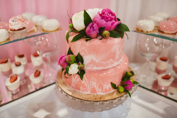 istock Wedding pink cake with flowers for wedding day. 1137296282
