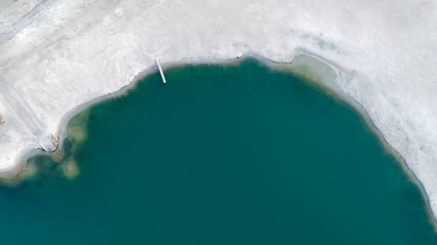 istock Abstract lakeshore, abandoned gravel pit - aerial view 1137301919