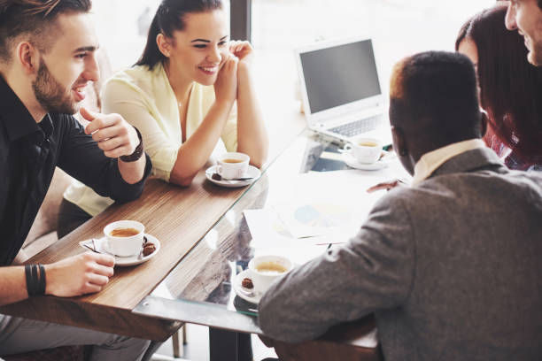 istock Group of entrepreneurs working using a laptop and holding a document 1137303465