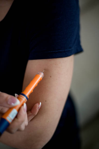 istock Young diabetic woman injecting insulin in hers arm 1137303969