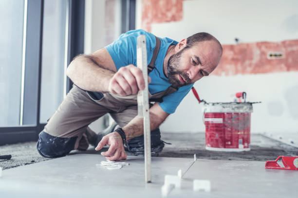 istock Adult tile mason leveling the floor 1137304486