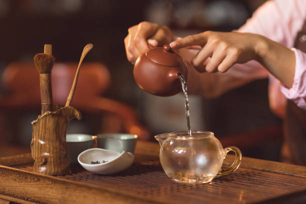 istock Young woman pouring tea 1137305373