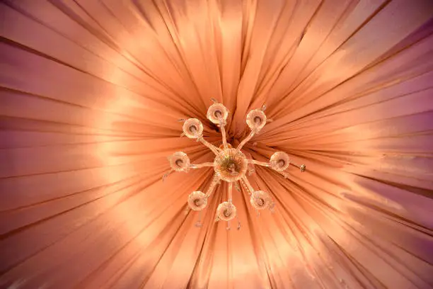 Photo of golden background of chandelier for interior decoration