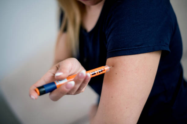 istock Female diabetes patient doing insulin injection 1137308070