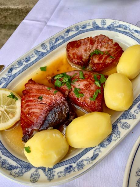 Grilled tuna steak in wine sauce with potatoes