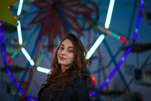 istock Young girl in amusement park 1137308910