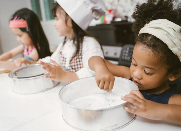 istock kids are preparing the bakery in the kitchen 1137311547