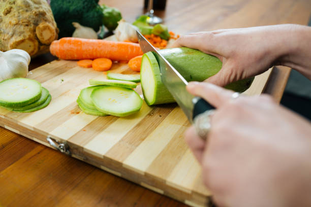 istock Woman in the Kitchen Chopping Some Veggies 1137313676