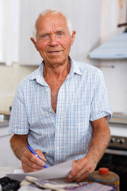 istock Enthusiastic man making list of repair works 1137313834