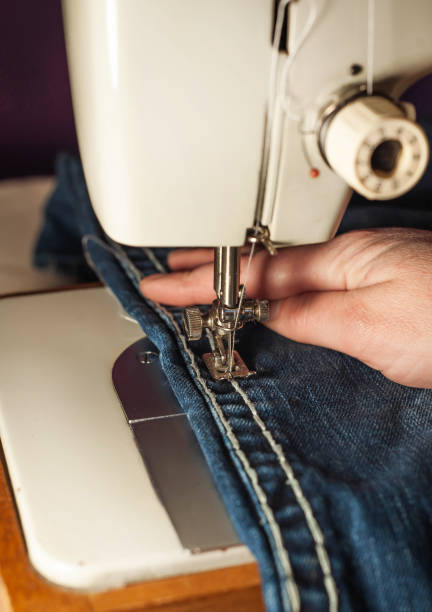 istock The sewing process. Sewing female hands. sewing industry workshop 1137316396