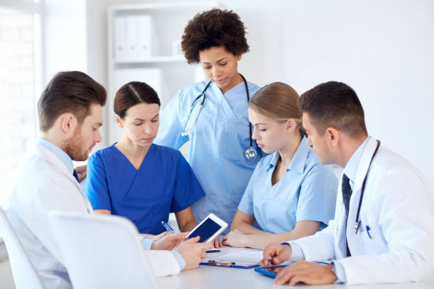 istock group of doctors with tablet pc at hospital 1137316545
