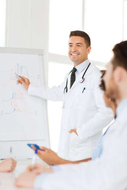 istock group of doctors on presentation at hospital 1137319345