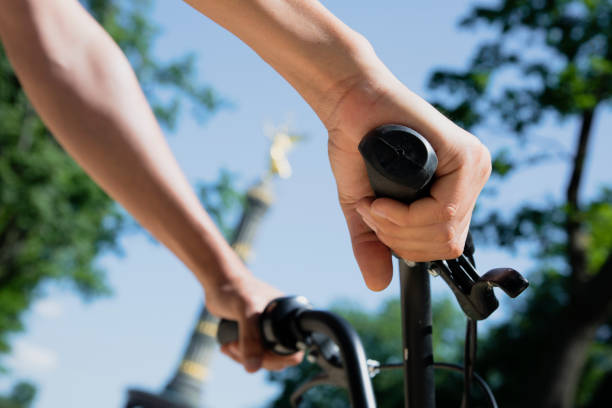 istock man riding a bike in front of the Victory Column 1137320251