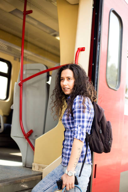 istock Girl comes into compartment from corridor of train, a trip in summer 1137320506