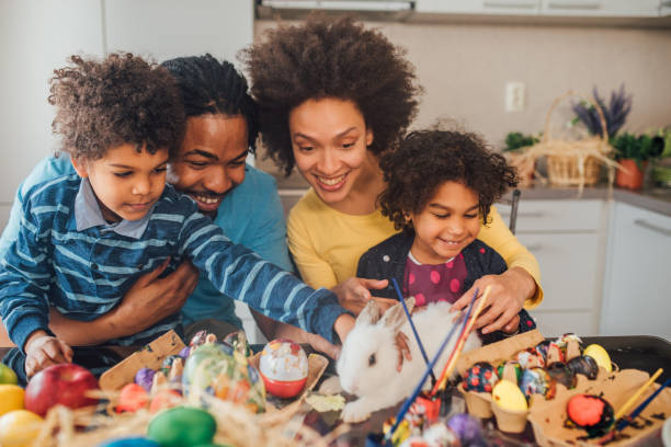 istock Family petting white rabbit 1137320520