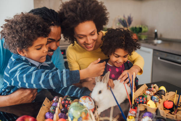 istock Family petting rabbit 1137320565