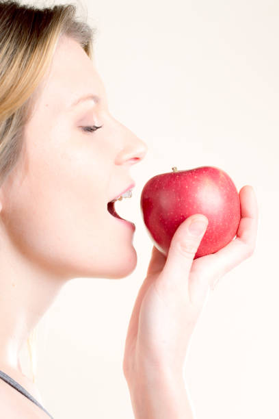 istock cute girl loves her apple 1137323150