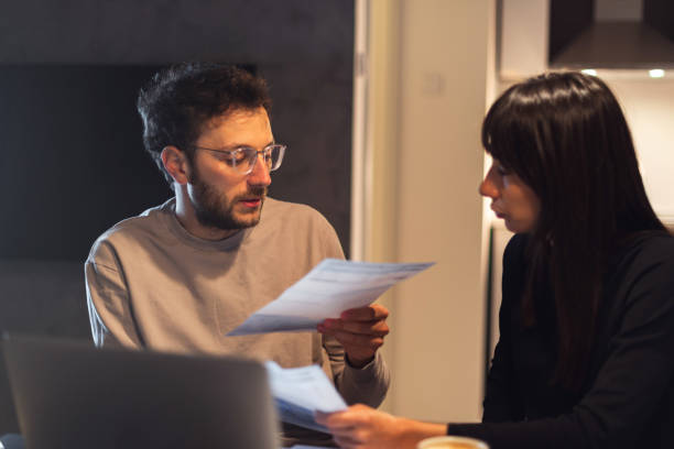 istock Couple is paying bills from home 1137326101