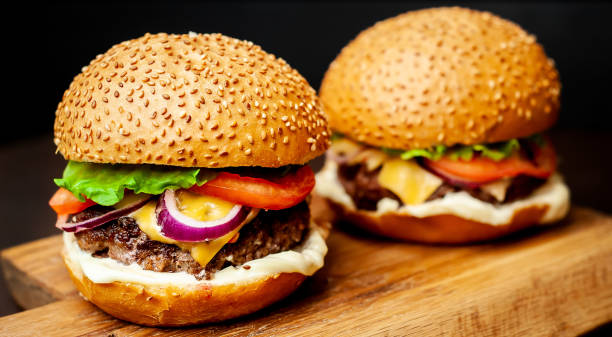 istock Two Delicious Fresh Homemade Burger on a Cutting Board 1137327776