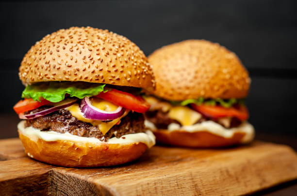 istock Two Delicious Fresh Homemade Burger on a Cutting Board 1137327778