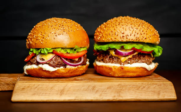 istock Two Delicious Fresh Homemade Burger on a Cutting Board 1137327858