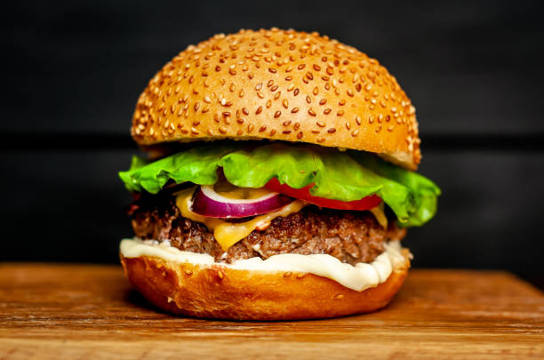 istock Delicious fresh homemade burger on a cutting board 1137327864