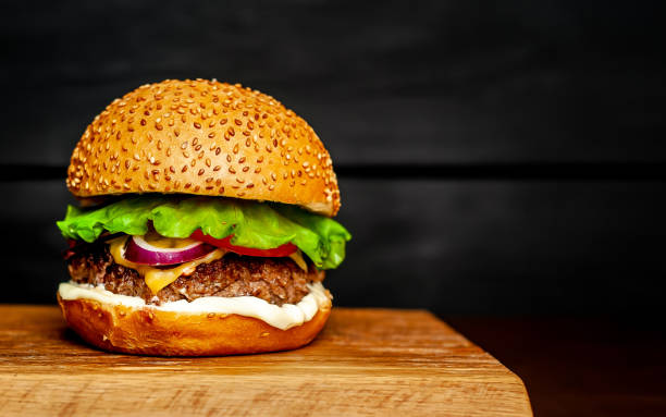 istock Delicious fresh homemade burger on a cutting board 1137327877