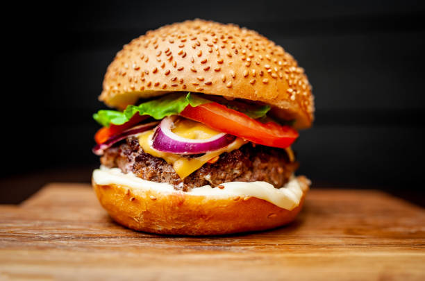 istock Delicious fresh homemade burger on a cutting board 1137327967