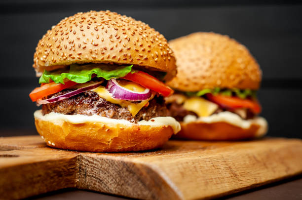 istock Two Delicious Fresh Homemade Burger on a Cutting Board 1137327970