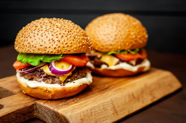 istock Two Delicious Fresh Homemade Burger on a Cutting Board 1137327973