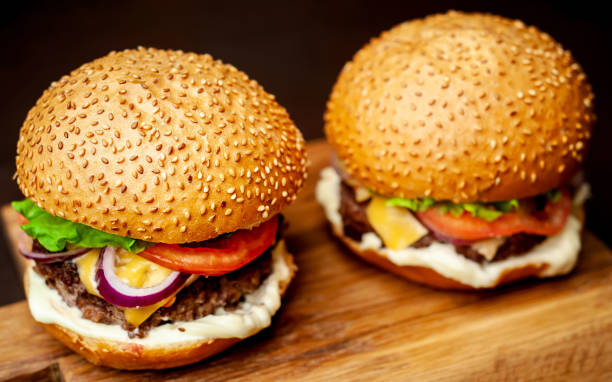 istock Two Delicious Fresh Homemade Burger on a Cutting Board 1137327978