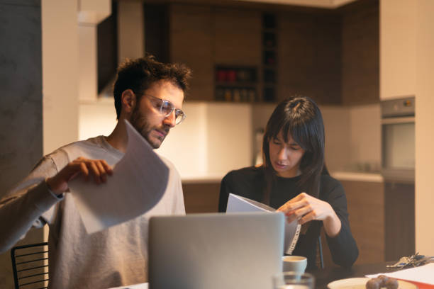 istock Couple is paying bills from home 1137328100